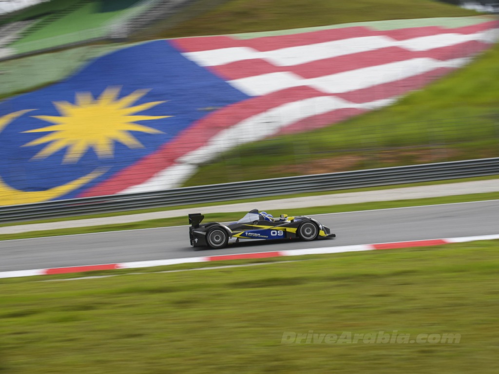 We drive Michelin racecars in Malaysia, and take 2 readers with us
